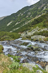 Fototapeta na wymiar Cloudy Landscape of Malyovitsa river valley, Rila Mountain, Bulgaria