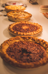 Holiday season pies sitting on a counter top © Ted