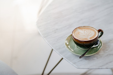 Hot latte coffee placed on the table