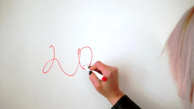 Simdes White - Woman Writing Numbers On A Plain White Board With A Red Inked Marker - Close-up Shot