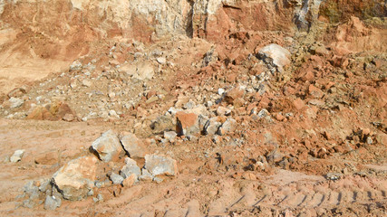 Fototapeta premium Quarry for the extraction of clay. Pieces of unprocessed clay.