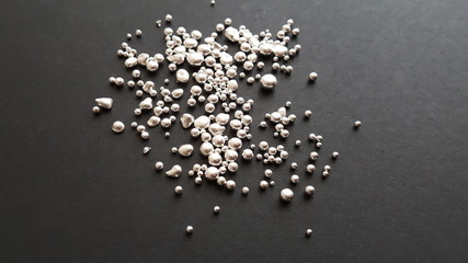 silver grains on a black background