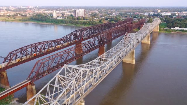 Aerial of landmark three steel bridges over the Mississippi River with Memphis, Tennessee background.