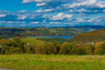 Fototapeta na wymiar landscape with lake, hills and clouds