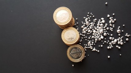 metal Turkish lira and silver grains