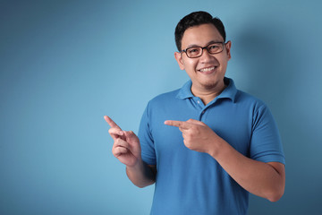 Asian Man Presenting Something on His Side with Copy Space © airdone
