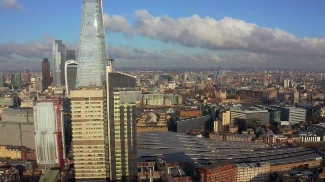 Stunning panoramic view of London city district - with Tower bridge, London railway near by and the Shard skyscraper in the foreground. Beautiful London video.