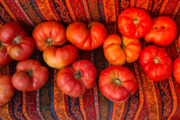Red ripe tasty fresh delicious tomato vegetables in bazaar market