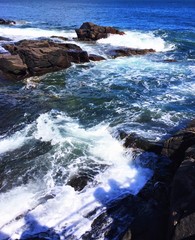 waves crashing on rocks