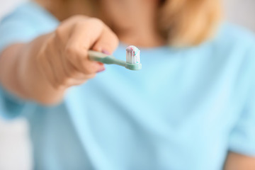 Young woman with tooth brush, closeup