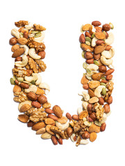 Letter U of the English alphabet from a mixture of hazelnuts, almonds, walnuts, peanuts, cashews, pumpkin seeds on a white isolated background. Food pattern made from nuts. Bright alphabet for shops.