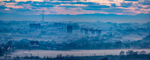 Naklejka premium Panorama of the evening Ukrainian city in the haze