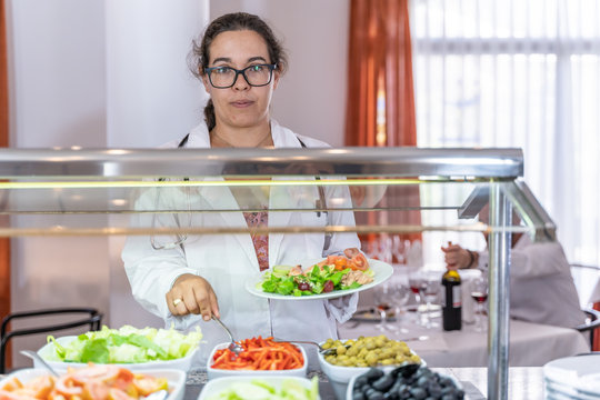 Doctor taking food from a self service restaurant