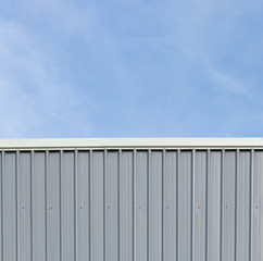 Metal sheet roof and wall steel with louver build factory and warehouse with blue sky.