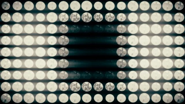 4k Animated flashing lights wall background. VJ floodlight shiny lights turning on and off. Disco nightclub lights matrix.