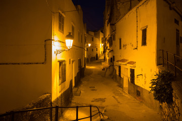 Night view of the old streets in the Tetouan Medina quarter in Northern Morocco. A medina is...