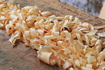Yellow shavings on the table in the manufacture of wooden products