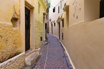 View of the one of the old streets in the Tangier Medina quarter in Northern Morocco. A medina is typically walled, with many narrow and maze-like streets.