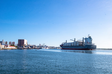 cargo ship in port, ship arriving in the city on a sunny day, port of Ribeira in Natal Rio Grande...