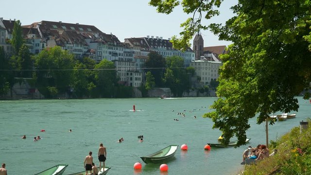 basel city sunny day riverside crowded swimming area boat parking bay view panorama 4k switzerland