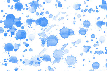 Dropped watercolor on paper in blue color for background