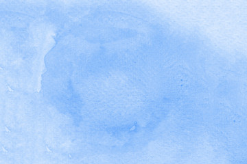 Watercolor texture on paper in blue color for background