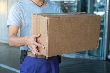 Delivery man deliver parcels.