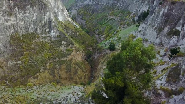Aerial shot deep canyon near Quilotoa, Ecuador caldera in the Andes Mountains.