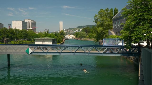 zurich city sunny summer day central river swimming area bridge panorama 4k switzerland