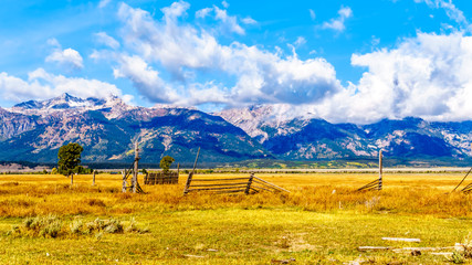 Abandoned Farmlands at Mormom Row with Cloud covered Peaks of the Grand Tetons In Grand Tetons National Park near Jackson Hole, Wyoming, United States