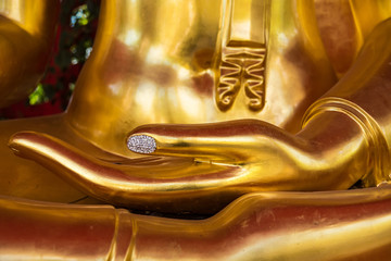 Close up hand of Buddha statue.