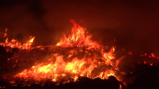 2019 - huge flames rise at night as the Cave Fire near Santa Barbara, California burns vast acres of Southern California hillsides.