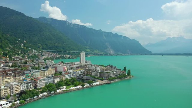 day time flight over montreux city geneva lake famous festival bay aerial panorama 4k switzerland