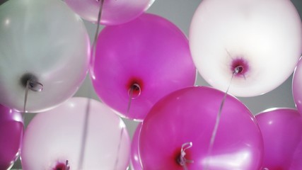 Image of pink and white balloons - view from under