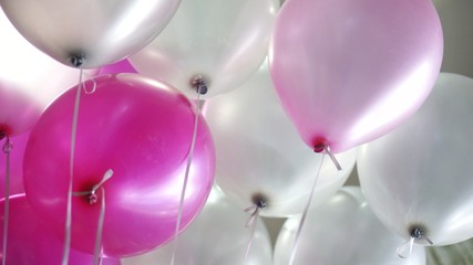 Image of pink and white balloons - view from under
