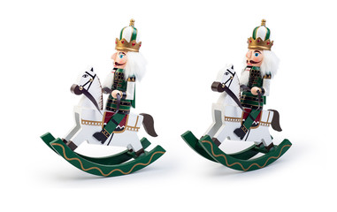 Traditional Figurine Christmas Nutcracker Wearing An Old Military Style Uniform on a horse isolated...