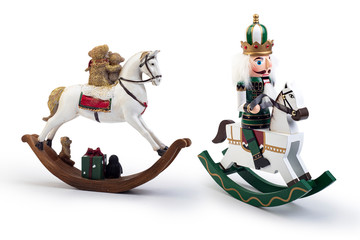 Traditional Figurine Christmas Nutcracker Wearing An Old Military Style Uniform on a horse isolated...