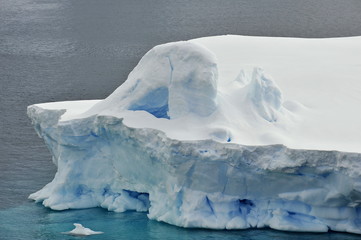 The majestic and harsh nature of Antarctica. Mountains covered by ice and snow in Antarctica. The most beautiful places on planet Earth. Icebergs and glaciers.