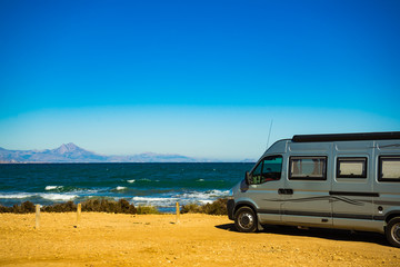 Fototapeta na wymiar Camper van on beach, camping on nature