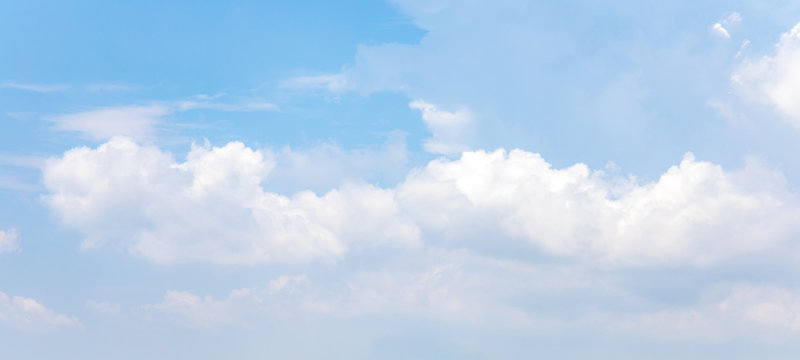Panorama or panoramic photo of blue sky and white clouds or cloudscape.