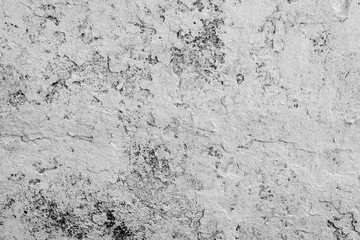 Texture of a concrete wall with cracks and scratches which can be used as a background
