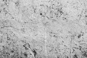 Texture of a concrete wall with cracks and scratches which can be used as a background