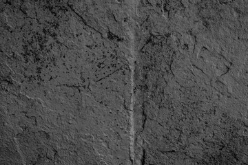 Fototapeta premium Texture of a concrete wall with cracks and scratches which can be used as a background