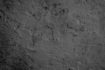 Texture of a concrete wall with cracks and scratches which can be used as a background