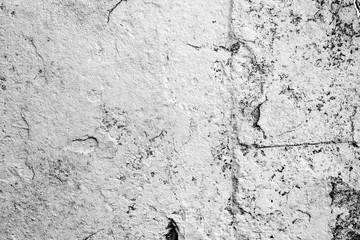 Texture of a concrete wall with cracks and scratches which can be used as a background