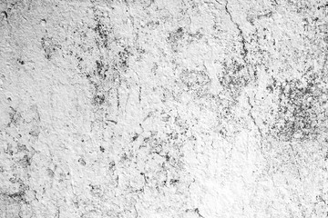 Texture of a concrete wall with cracks and scratches which can be used as a background