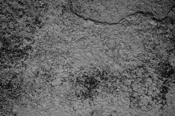 Texture of a concrete wall with cracks and scratches which can be used as a background