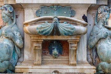 Fountain details in the historic centre of Bologna, Italy