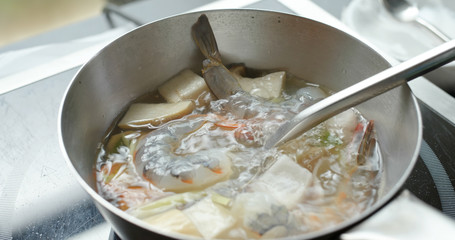 Cook Tom Yum soup in kitchen