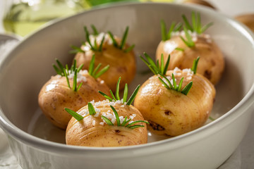 Ingredients for homemade baked potatoes made of herbs and salt